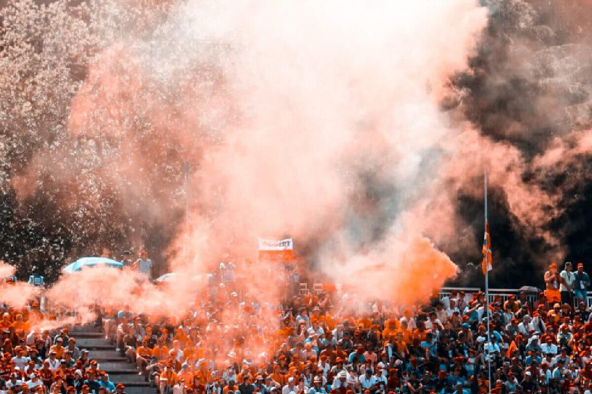 Coloured smoke plumes from a sports game