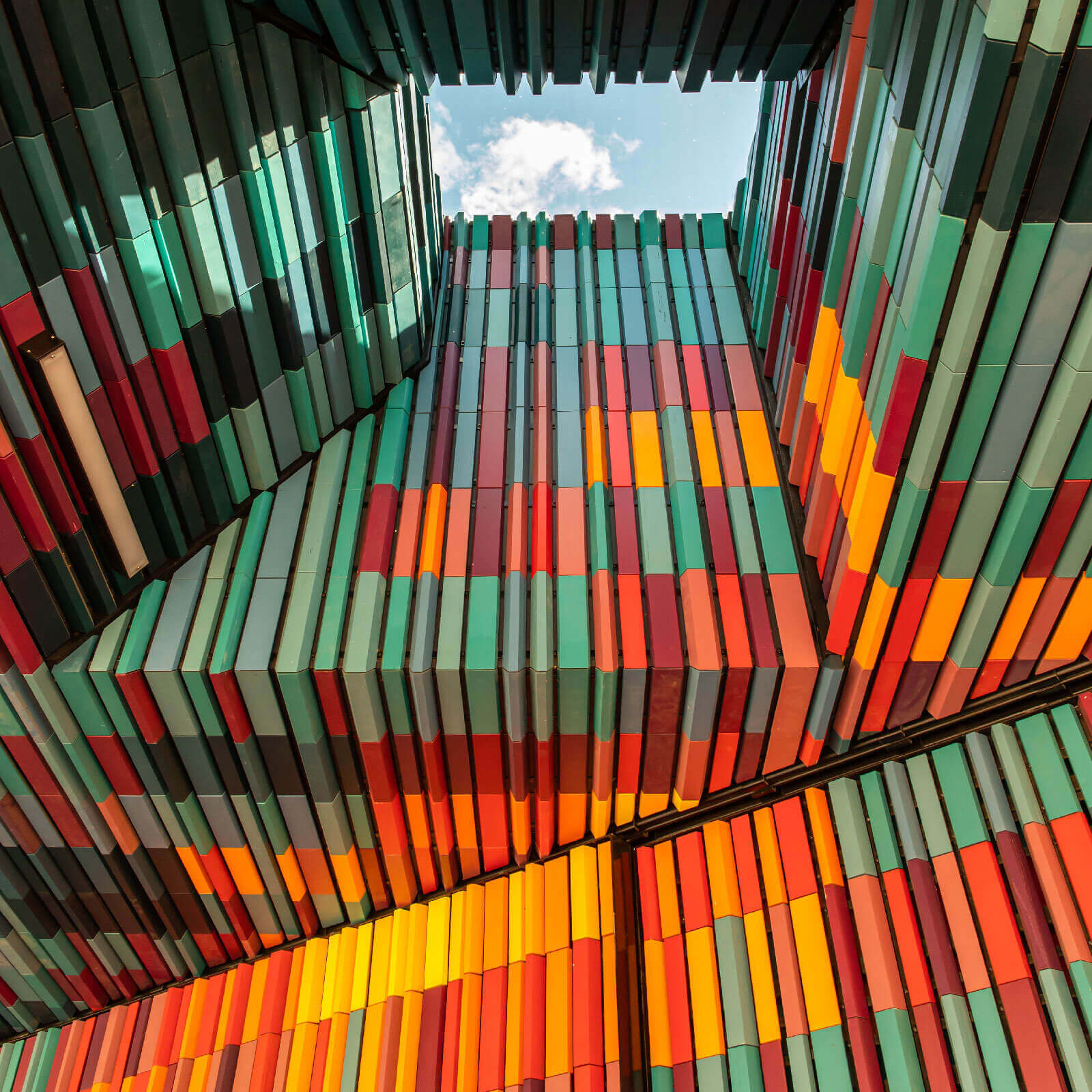 Colourful abstract architecture with a glimpse of the sky